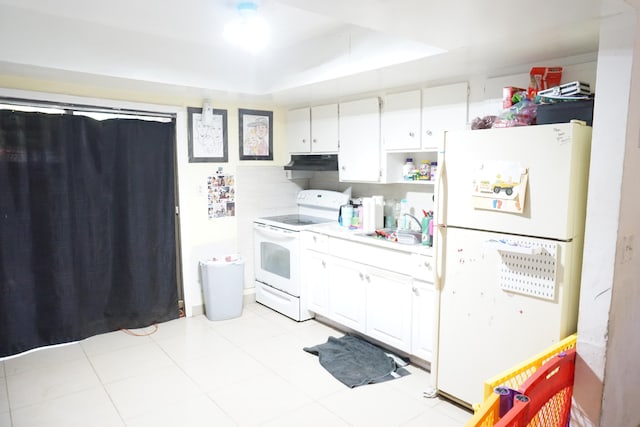 kitchen with sink, white cabinets, white appliances, and light tile patterned floors