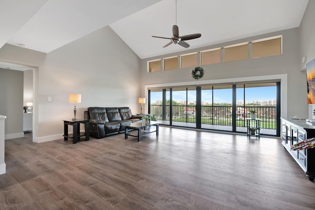 living room featuring ceiling fan, hardwood / wood-style floors, and plenty of natural light