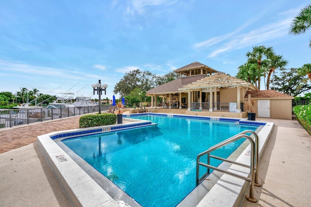 view of swimming pool featuring a patio area