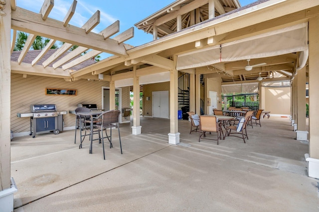 view of patio / terrace with a pergola and a grill