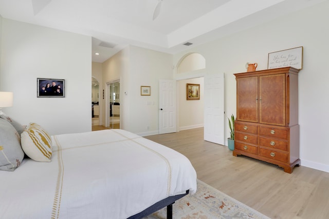 bedroom featuring ceiling fan and light hardwood / wood-style flooring