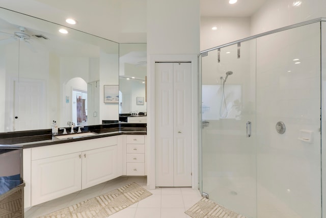 bathroom featuring an enclosed shower, vanity, tile patterned flooring, and ceiling fan