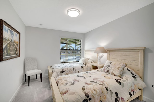 bedroom with light colored carpet