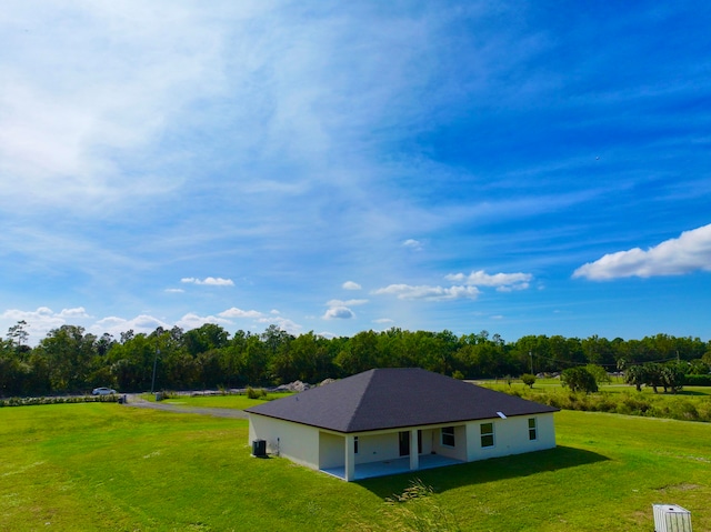 view of home's exterior featuring a patio and a lawn