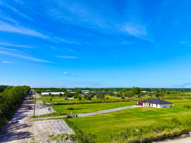 birds eye view of property featuring a rural view