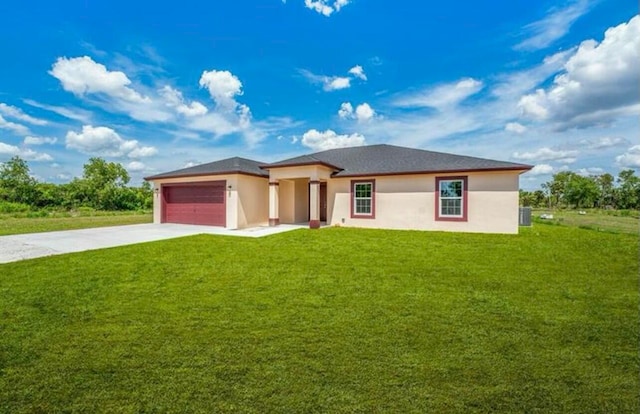 prairie-style house featuring a garage and a front yard