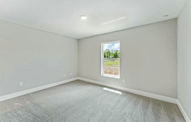 unfurnished room with carpet floors