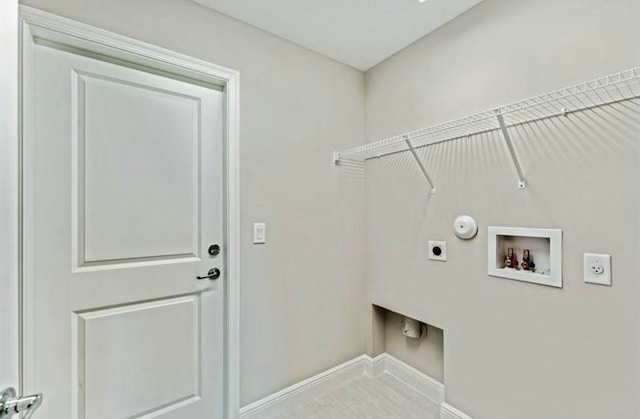 laundry room featuring hookup for an electric dryer, hookup for a washing machine, and hookup for a gas dryer