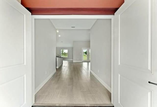 hallway with light wood-type flooring