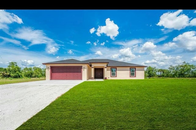 view of front of property featuring a front lawn and a garage