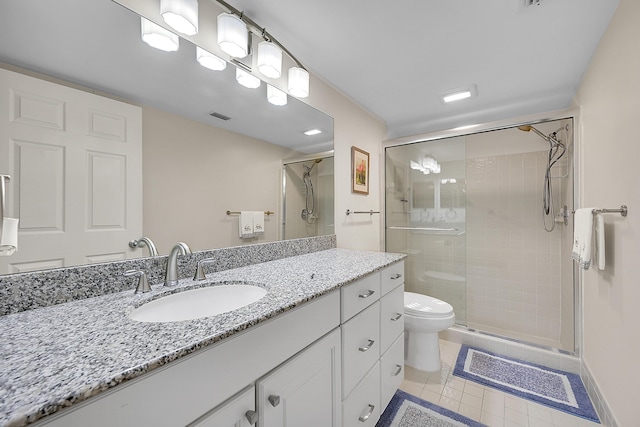 bathroom featuring an enclosed shower, vanity, tile patterned floors, and toilet