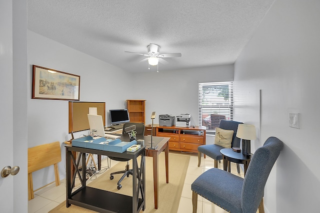 home office featuring light tile patterned floors, a textured ceiling, and ceiling fan