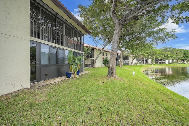 view of yard with a water view