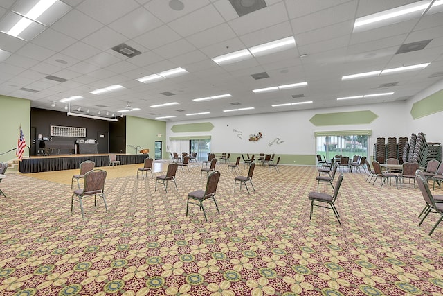 miscellaneous room with a paneled ceiling, a bowling alley, and carpet floors