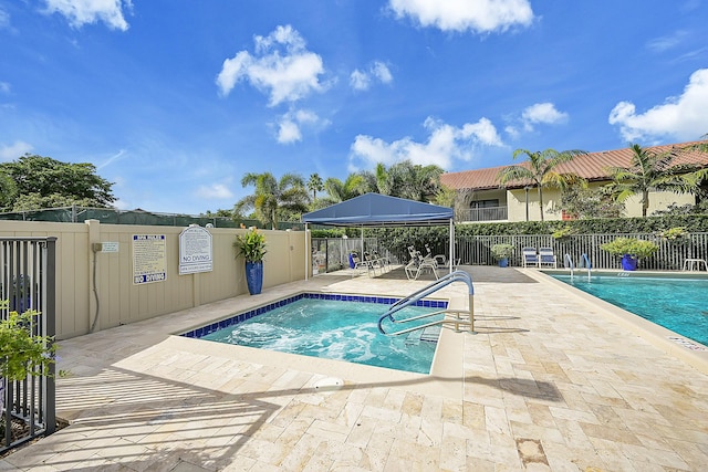 view of swimming pool with a patio area