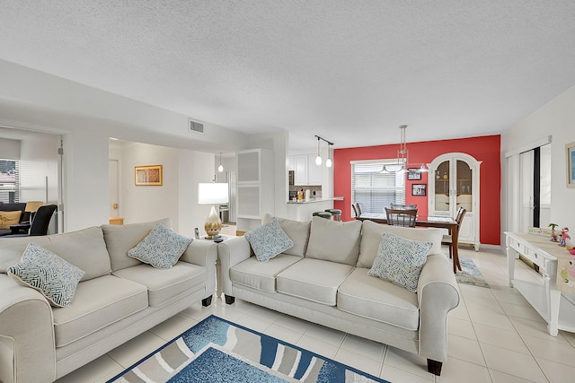 tiled living room with a textured ceiling