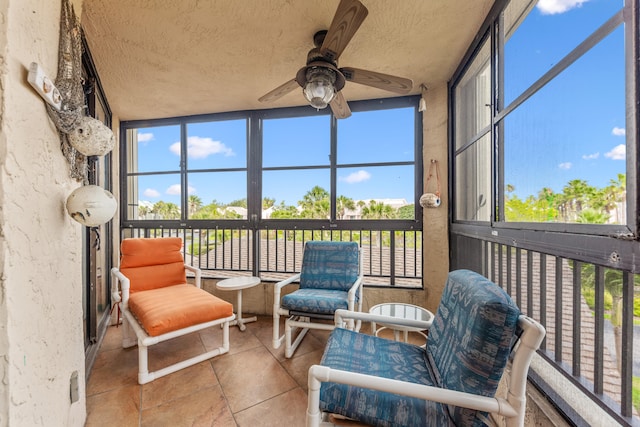 sunroom / solarium featuring ceiling fan and a healthy amount of sunlight