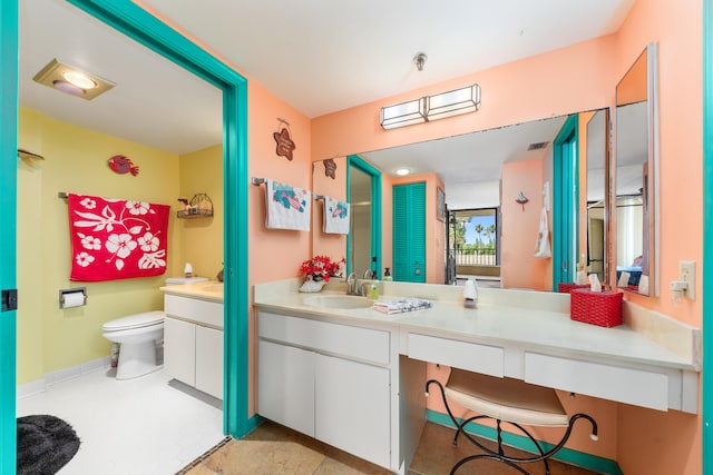 bathroom with vanity and toilet