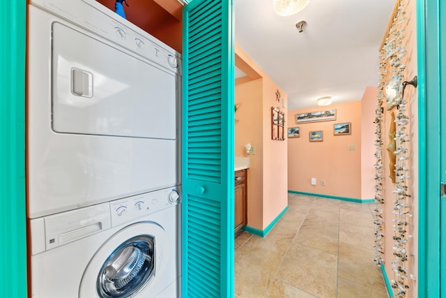 laundry room with stacked washer and dryer