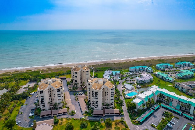 bird's eye view featuring a water view and a view of the beach