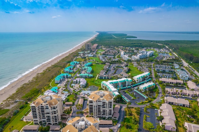 birds eye view of property featuring a water view and a view of the beach