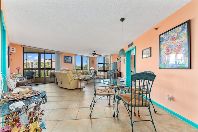 dining space featuring light tile patterned floors, a textured ceiling, and ceiling fan