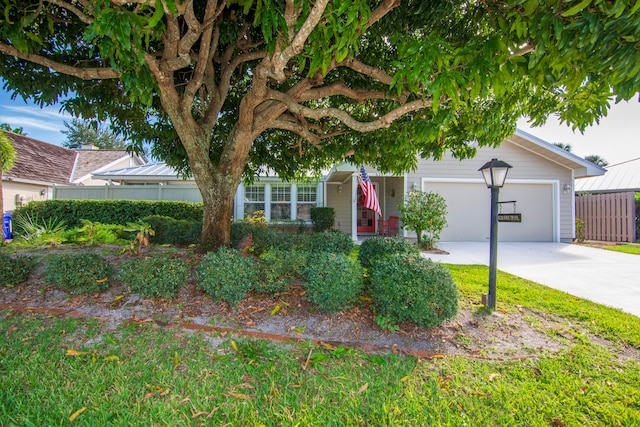 obstructed view of property with a garage