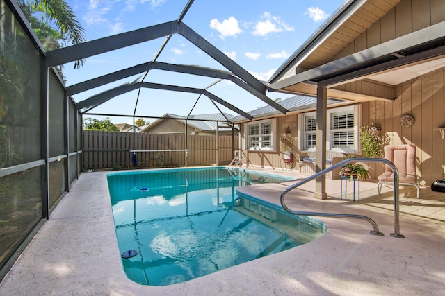 view of pool featuring a fenced in pool, a lanai, a patio area, and fence