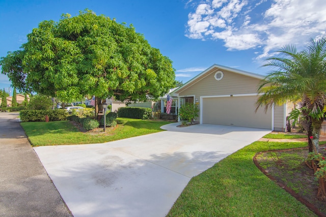 view of front of house featuring a front lawn and a garage