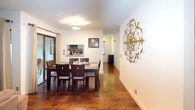 dining area with dark hardwood / wood-style floors