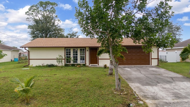 single story home featuring a garage and a front lawn