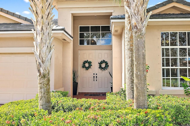 doorway to property featuring a garage