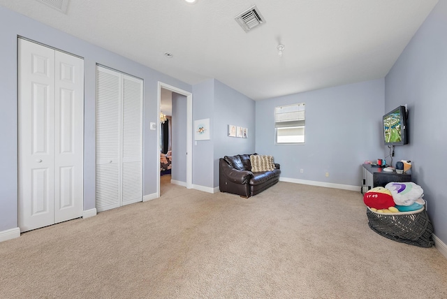 living area with light carpet