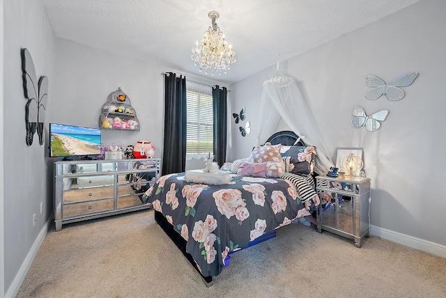 bedroom featuring carpet flooring, a textured ceiling, and a notable chandelier