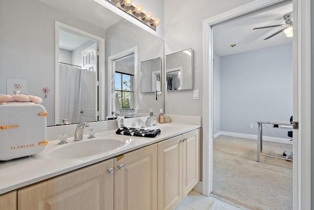 bathroom featuring tile patterned floors, ceiling fan, and vanity