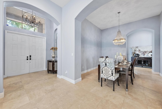 dining area with a notable chandelier