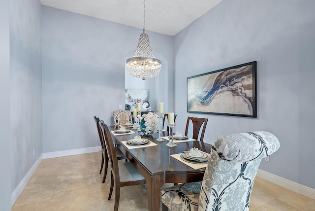 dining space featuring a notable chandelier