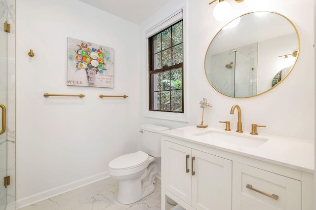 bathroom with vanity, toilet, and a shower with door