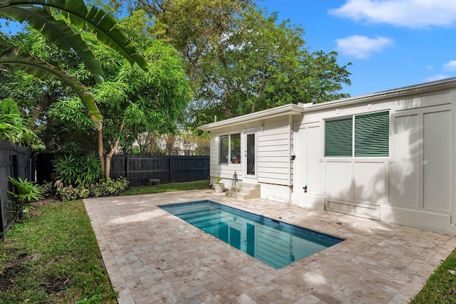 view of swimming pool with a patio area