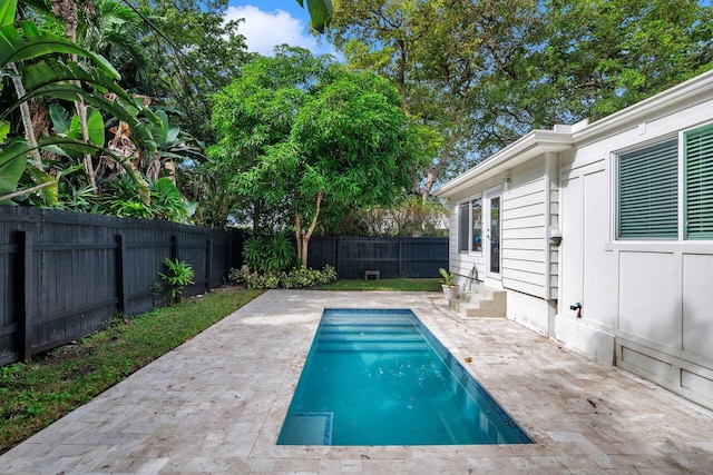 view of swimming pool featuring a patio area