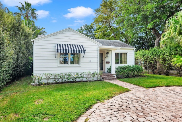 bungalow-style house with a front yard