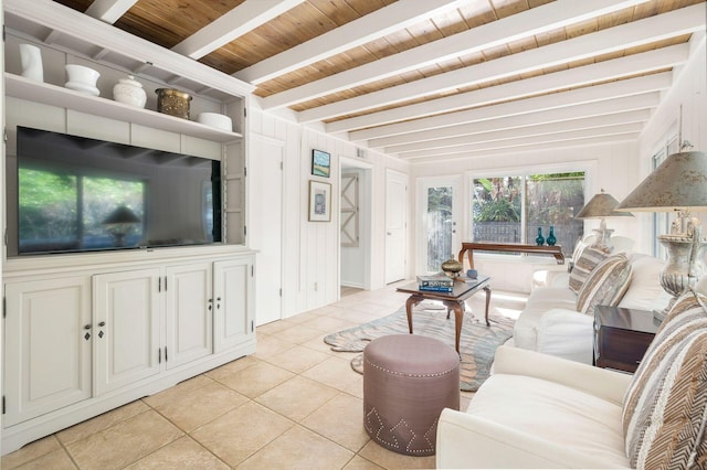 living room with beamed ceiling, light tile patterned floors, and wood ceiling