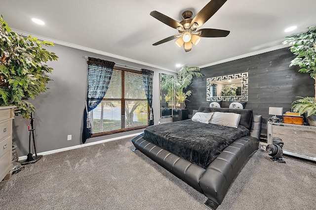 carpeted bedroom featuring ceiling fan, wooden walls, and ornamental molding