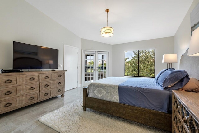 bedroom with access to outside, french doors, and vaulted ceiling