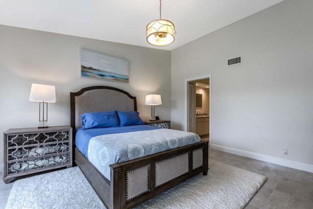 bedroom featuring connected bathroom