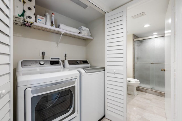 clothes washing area with washer and dryer