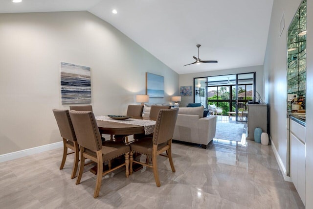 dining room featuring ceiling fan and high vaulted ceiling