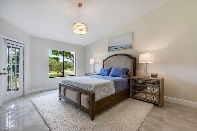 bedroom with access to exterior and vaulted ceiling