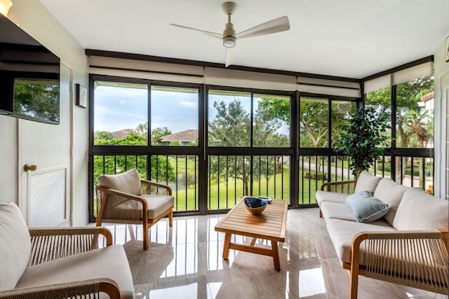 sunroom featuring ceiling fan