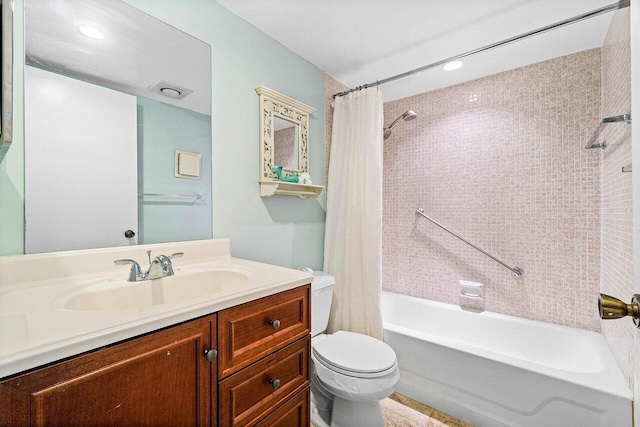 full bathroom with vanity, toilet, and shower / tub combo with curtain